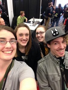 Professor Woodard with her students at Bangor Comic and Toy Convention in April.