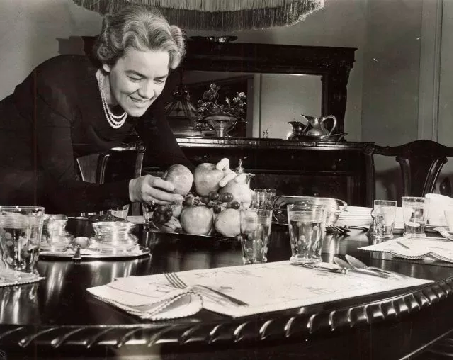 Margaret Chase Smith is shown setting a table