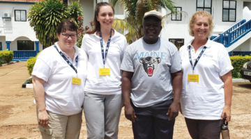 Honors Faculty and student are shown visiting Sierra Leone