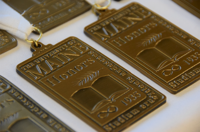 An image of Honors medallions displayed on a table.