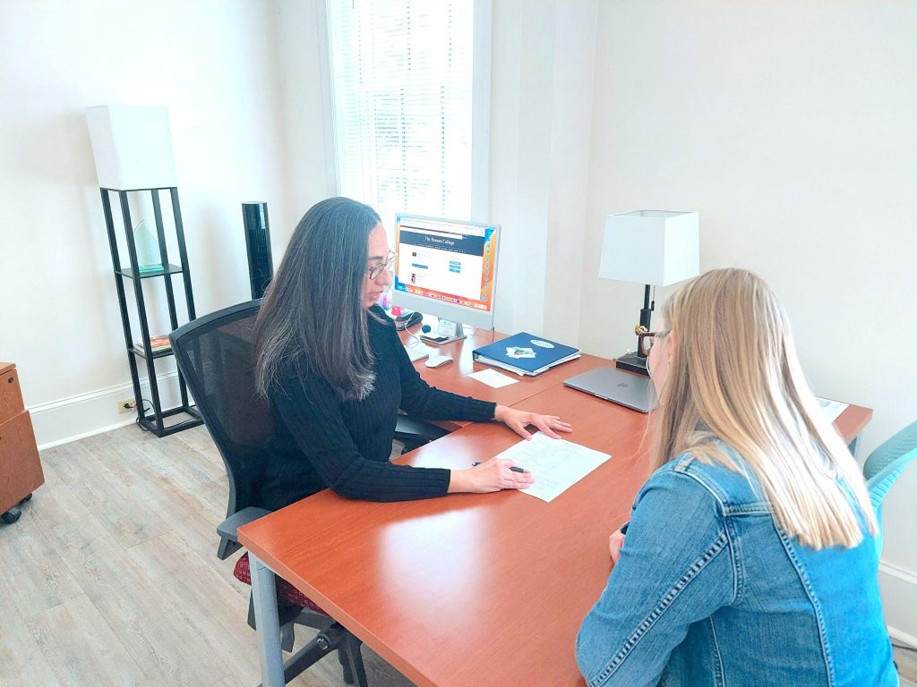 A photo of the Honors advisor advising a student