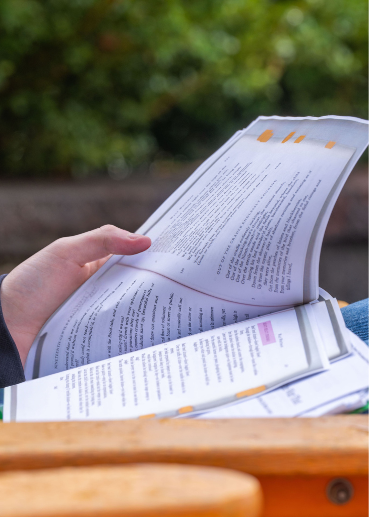 A photo of a hand holding a piece of paper
